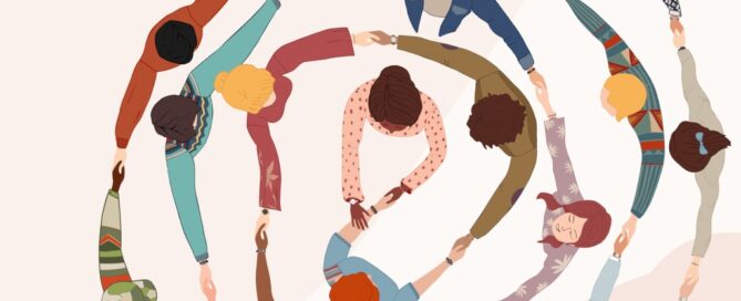 group of people in a circle, holding hands in cooperation