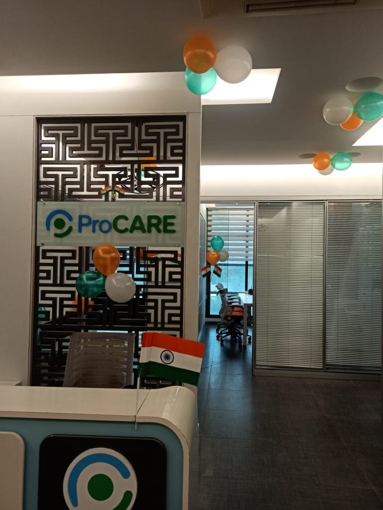 This image shows the front desk at ProCARE's office, adorned by green, orange, and white balloons alongside small Indian flags to mark India's Independence Day.